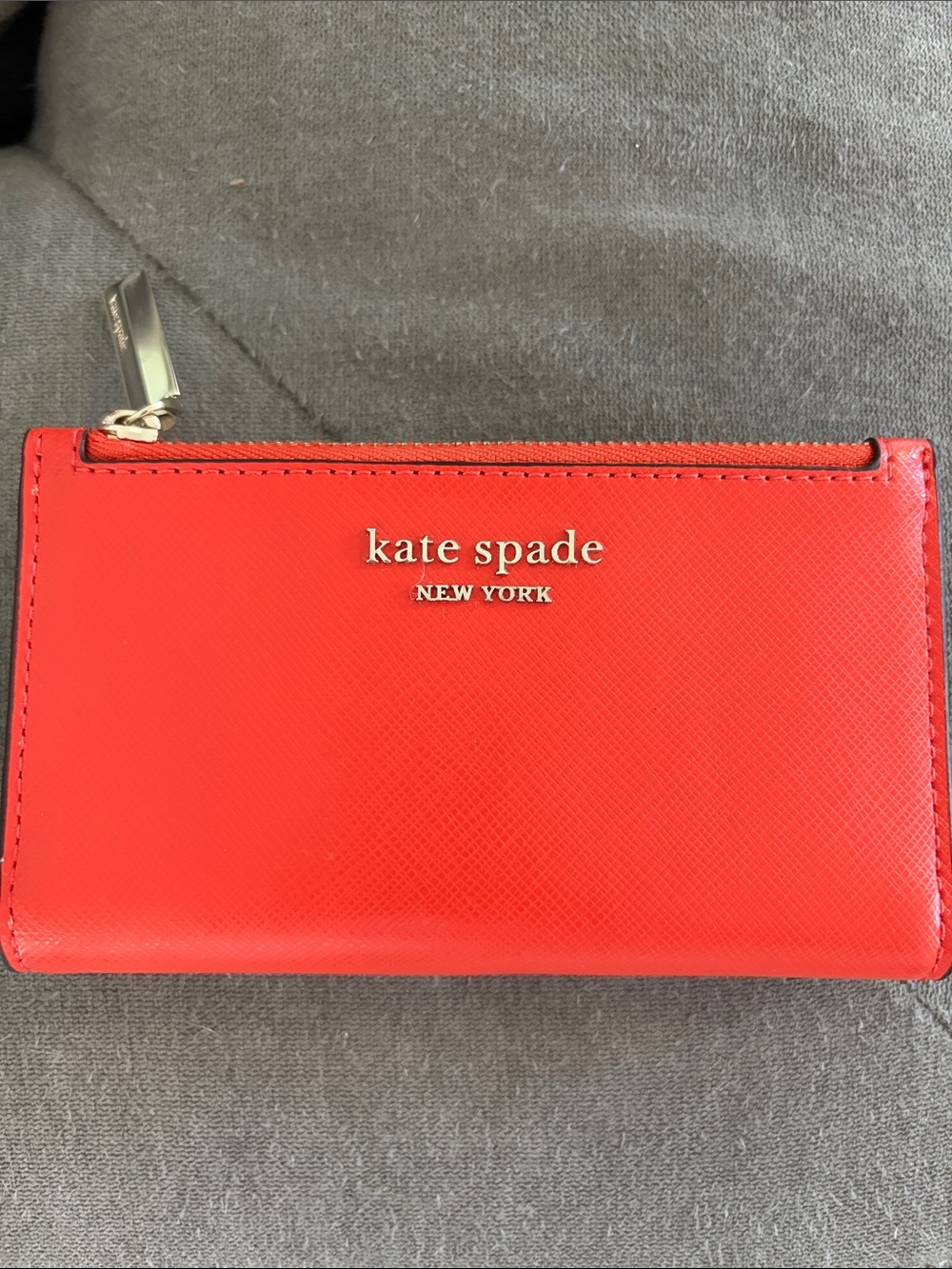 kate spade red zip card case with gold logo